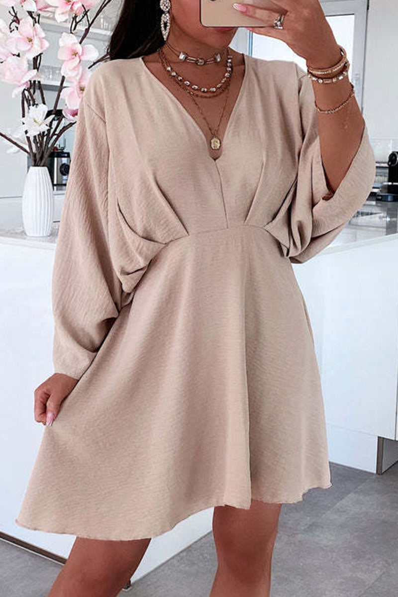 Pamela Chic Long Sleeved Dress with an Asymmetrical V Neck and Irregular Cut Evening Wear Edit