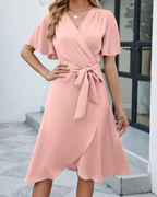 Felicity Statement Short Sleeved Flared Dress with a V Neckline and a Self Tie Belt Boutique Collection