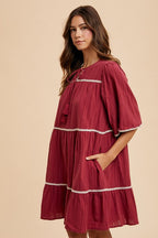 Aaliyah Boutique Tiered Dress with Tassels and Contrast Trim, Tied Neckline, Half Sleeves Designer Edit