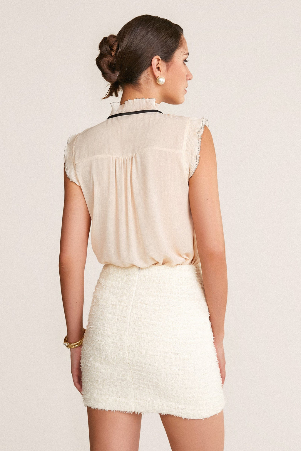 Ivory Sleeveless Ruffled Tie Neck Blouse