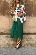 White denim overshirt embroidered with bright colors and pockets