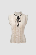 Ivory Sleeveless Ruffled Tie Neck Blouse