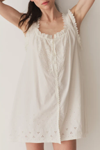 Short Skirt with Pearl Buttons and Scalloped Trim and Round Neck.