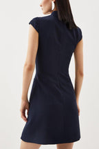 Ariana Chic Military Style Mini Dress with Cap Sleeves, Stand Up Collar and Patchwork Pleated Hem Silhouette Collection