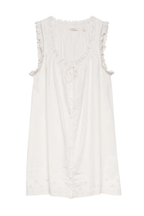 Short Skirt with Pearl Buttons and Scalloped Trim and Round Neck.