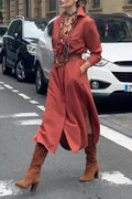 Satin shirt dress with a fitted waist and side slit.