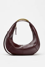 Metal handle crescent bag