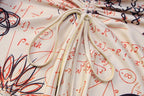 Long sleeve crewneck print drawstring ruched mini dress